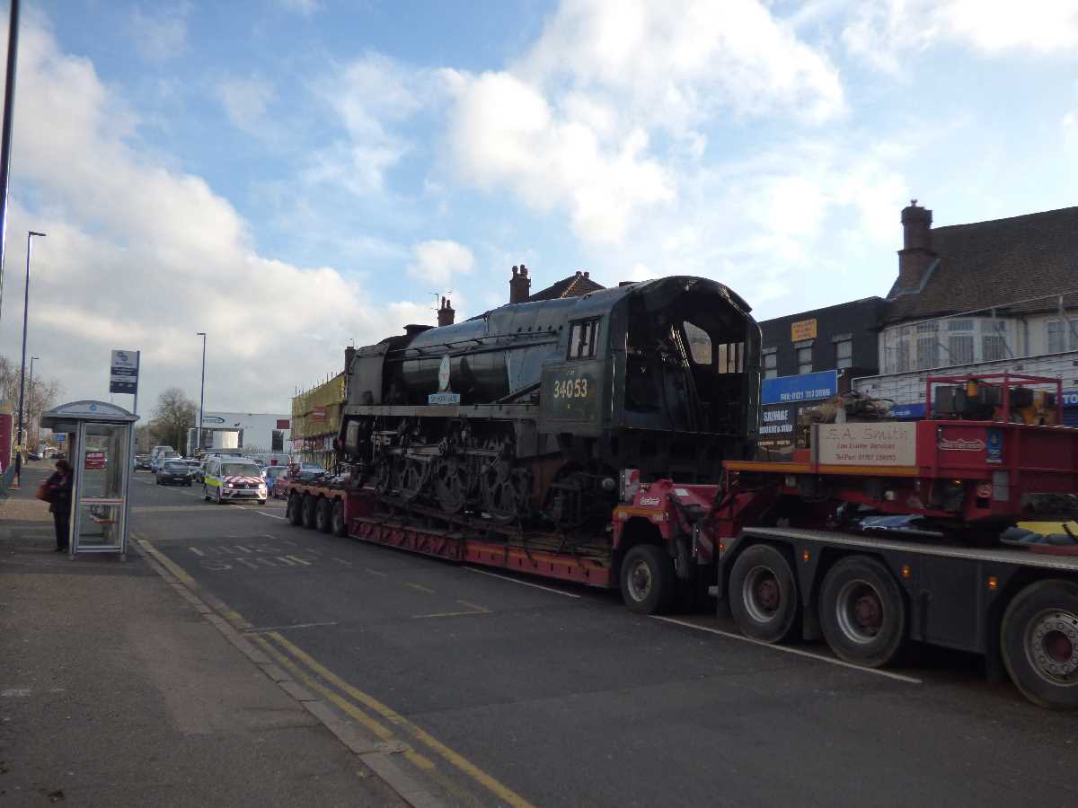 Not something you see every day: a steam locomotive on the back of a lorry!